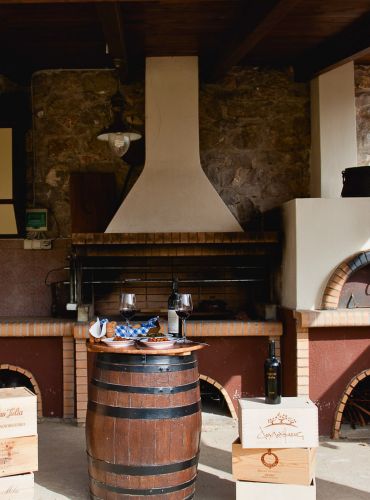 Casa Cinque private Greek wine experience with wine glasses and rustic setting