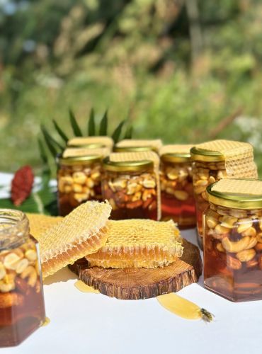 Greek honey tasting at Casa Cinque with jars of honey and honeycomb