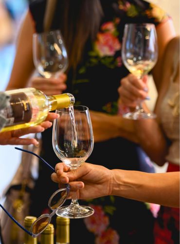 Greek wine being served during corporate tasting by Cinque Wine and Deli